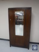 A 20th century oak mirror door wardrobe