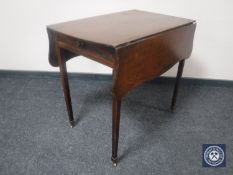 A Victorian mahogany flap-sided table fitted a drawer