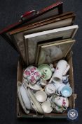 A box containing four framed needlework pictures, similar tray, assorted tea china,
