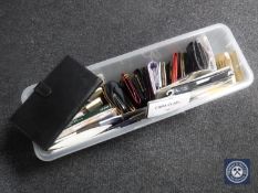 A quantity of lady's purses, together with a quantity of brand new lady's tights and stockings.