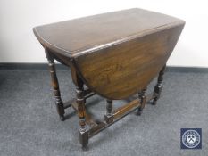 An oak gateleg table