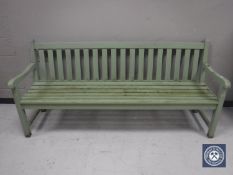 A painted teak garden bench