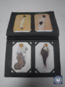 An album of early 20th century postcards including fashion,