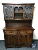 An oak linen fold double door dresser
