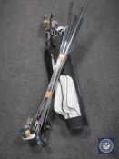 A golf bag of assorted left handed irons and drivers,