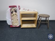 A boxed Leonardo Collection doll together with a floral tapestry,