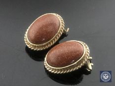 A pair of 9ct gold earrings