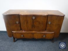 A mid 20th century walnut cocktail sideboard