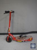 A Razor E100 electric scooter with charger