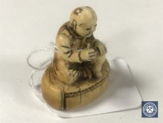 An ivory netsuke - Village Elder.