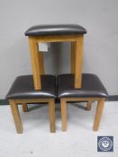 Two contemporary oak leather topped dressing table stools together with a pine topped dressing