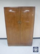 An early 20th century mahogany double door compactum wardrobe