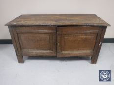 A 19th century oak double door low cupboard