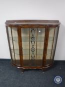 A mid 20th century walnut display cabinet
