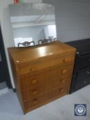 A teak four drawer dressing chest by Gibbs