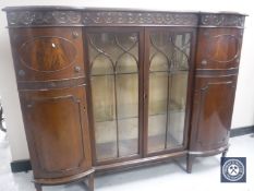 A Victorian mahogany four-door display cabinet.