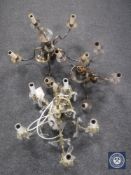 Three continental brass light fittings one with glass drops,