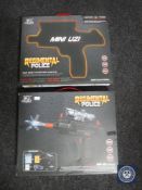 Two boxed Regimental Police mini uzi electric guns