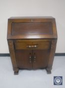 A 20th century oak writing bureau