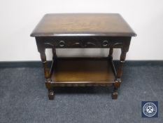 An oak two-tier hall table fitted two drawers