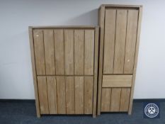 A contemporary pine four door storage cupboard and a matching pine sentry door cupboard