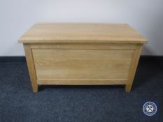 A contemporary oak blanket box