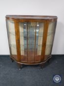 A mid 20th century walnut display cabinet