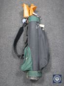 A golf bag of half set of Crookshank irons and four drivers