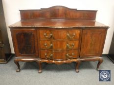 A late Victorian serpentine fronted mahogany sideboard, on claw and ball feet, width 183 cm.