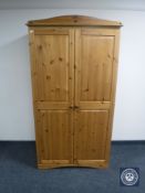 A pine double door wardrobe