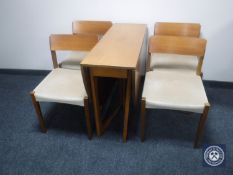 A late 20th century six-piece teak dining room suite