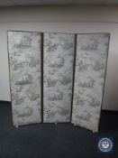 A mahogany framed three-way folding room divider