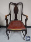 An early 20th century mahogany Queen Anne style armchair