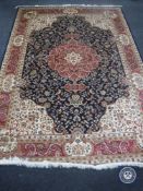 A blue Keshan carpet on blue ground,