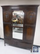 A Victorian mahogany mirror door wardrobe fitted two drawers beneath