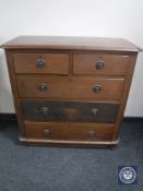 A Victorian oak five drawer chest