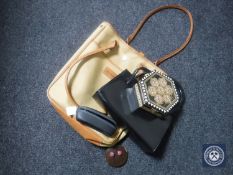 A Barbour canvas bag containing a leather handbag, glasses in case,