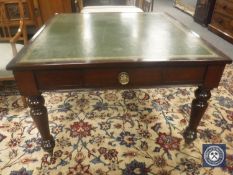 A late Victorian mahogany library table, with green tooled leather top, width 108 cm.