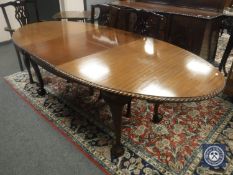 A late Victorian mahogany oval extending dining table, on claw and ball feet, length 240 cm.