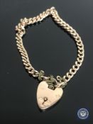 A 9ct gold padlock bracelet CONDITION REPORT: 11.