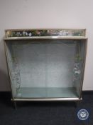 A mid 20th century melamine display cabinet