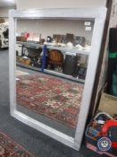 A silvered framed mirror