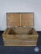 A stripped pine blanket box