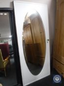 An early 20th century painted mirrored wardrobe door