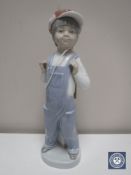 A Lladro figure - boy with accordion