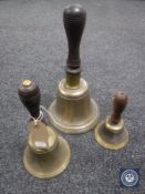 Three brass graduated hand bells