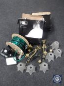A spool of Christmas lights, together with two outdoor security lights, two brass chandeliers,