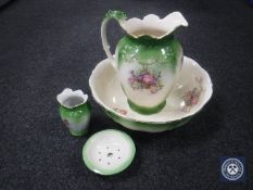 A four-piece Victorian floral pottery wash set