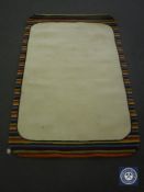 A hand tufted rug, striped border cream mix, 120 cm x 180 cm, rrp £297.