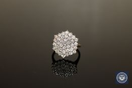 An 18ct gold diamond cluster ring,